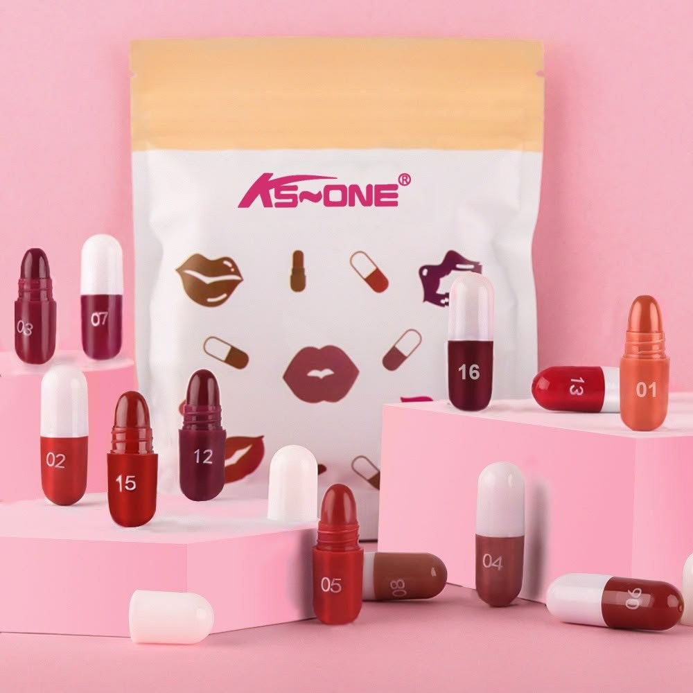 KS One Capsule Lipstick Set - 18 Colors Mini Matte Lipsticks Pouch Pack (1.4g x 18 Pcs) - Buy Online in Pakistan at Cosmia.pk - white and yellow pouch with numbered mini capsules on a pink studio background