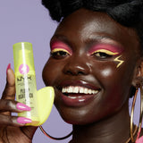 NYX Plump Right Back Plumping Serum and Primer bottle with silicone applicator held by model
