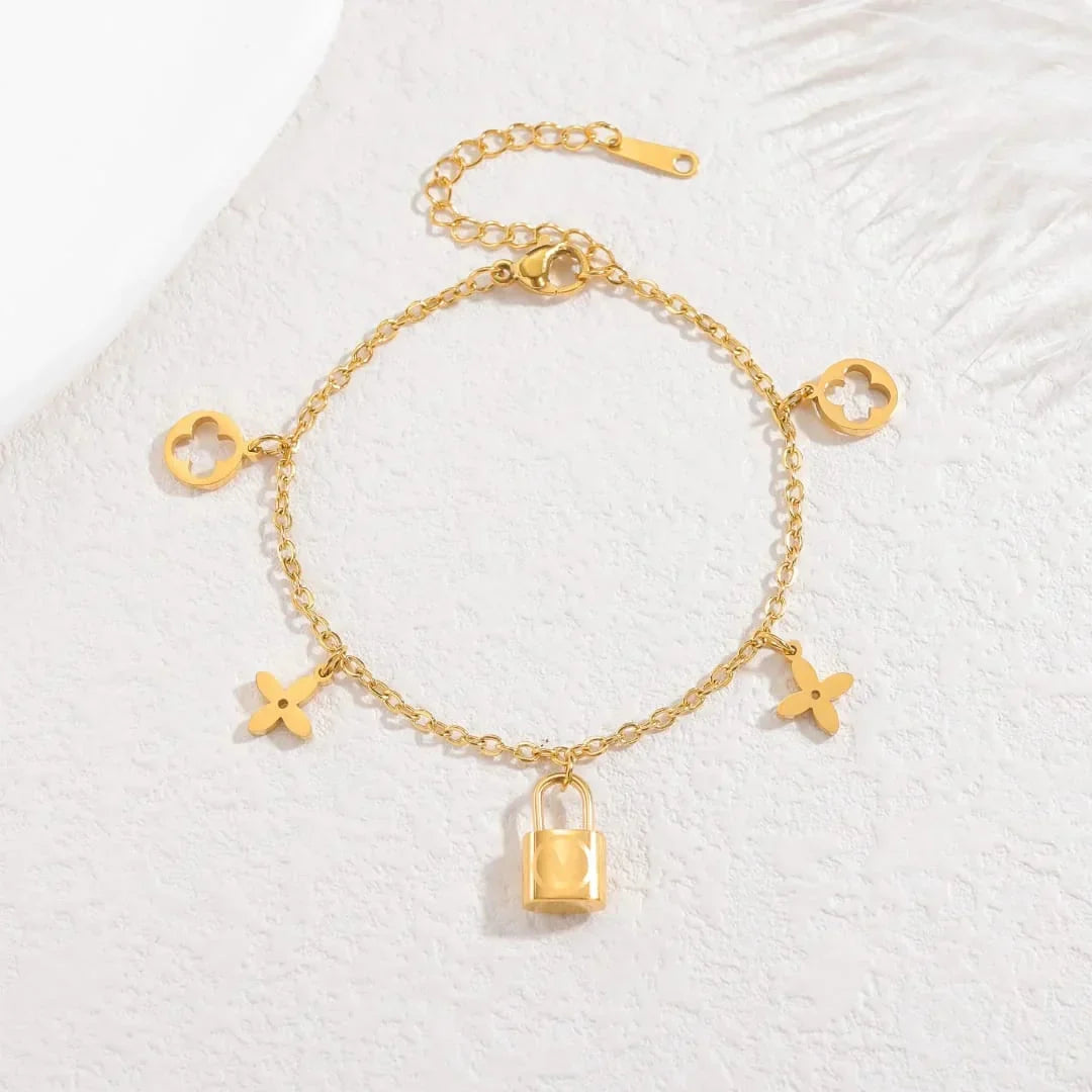 Stainless Steel Lock Charm Bracelet with Clover & Flower Design - Buy Online in Pakistan at Cosmia.pk