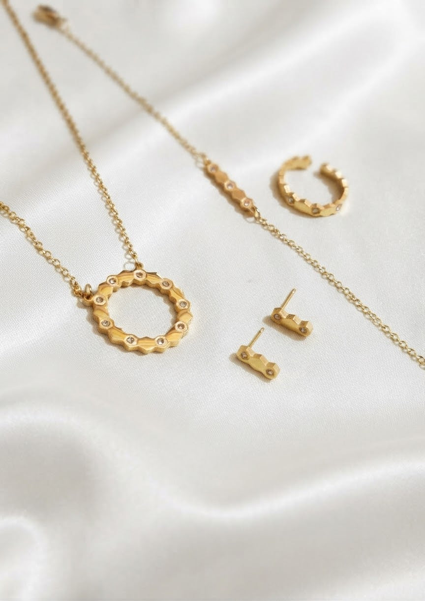 316L stainless steel golden honeycomb zircon jewelry set - 4 piece set with circle pendant necklace, bracelet, ring and stud earrings | Buy online in Pakistan