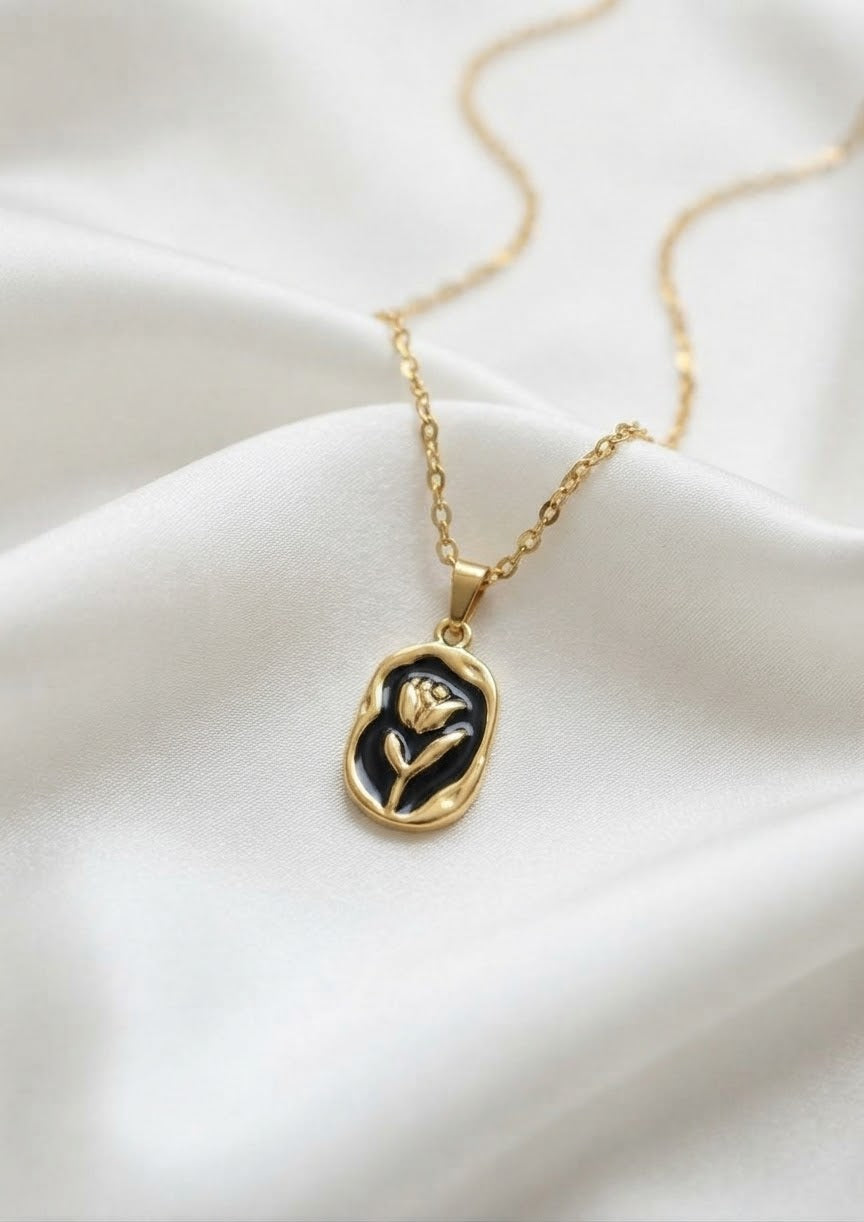 316L Stainless Steel Tulip Flower Pendant Necklace - Black enamel version, close-up flat lay of the black enamel tulip pendant - buy online in Pakistan at Cosmia.pk