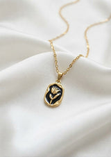 316L Stainless Steel Tulip Flower Pendant Necklace - Black enamel version, close-up flat lay of the black enamel tulip pendant - buy online in Pakistan at Cosmia.pk