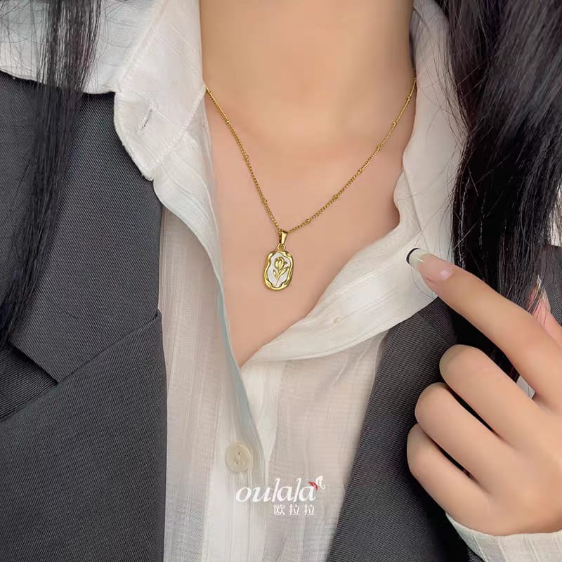 316L Stainless Steel Tulip Flower Pendant Necklace - White enamel version, model wearing the white tulip pendant necklace - buy online in Pakistan at Cosmia.pk