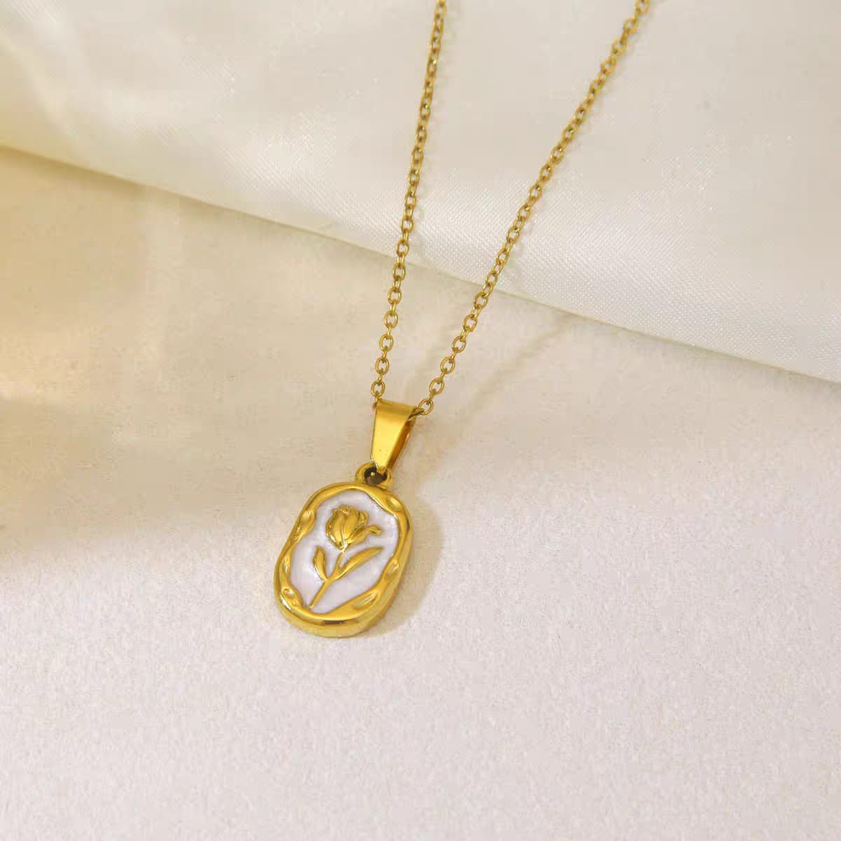 316L Stainless Steel Tulip Flower Pendant Necklace - White enamel version, close-up flat lay of the white enamel tulip pendant - buy online in Pakistan at Cosmia.pk