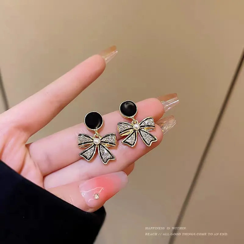 Rhinestone Bow Black Round Stud - Buy Online in Pakistan at Cosmia.pk