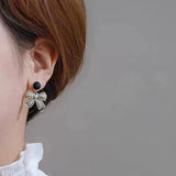 Rhinestone Bow Black Round Stud - Buy Online in Pakistan at Cosmia.pk