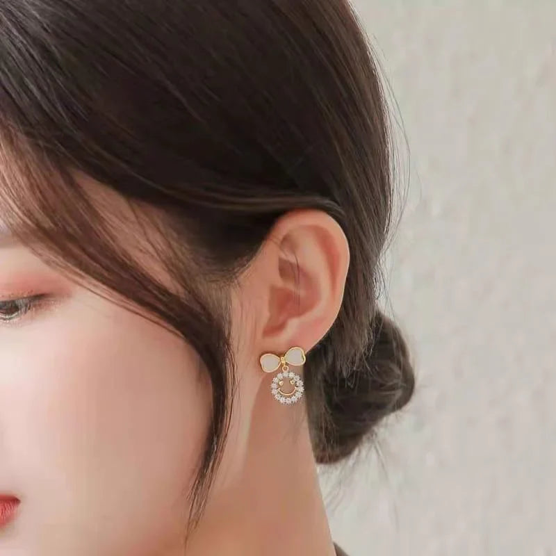 Elegant Bow Hollow Circle Drop Earrings – Each - Buy Online in Pakistan at Cosmia.pk