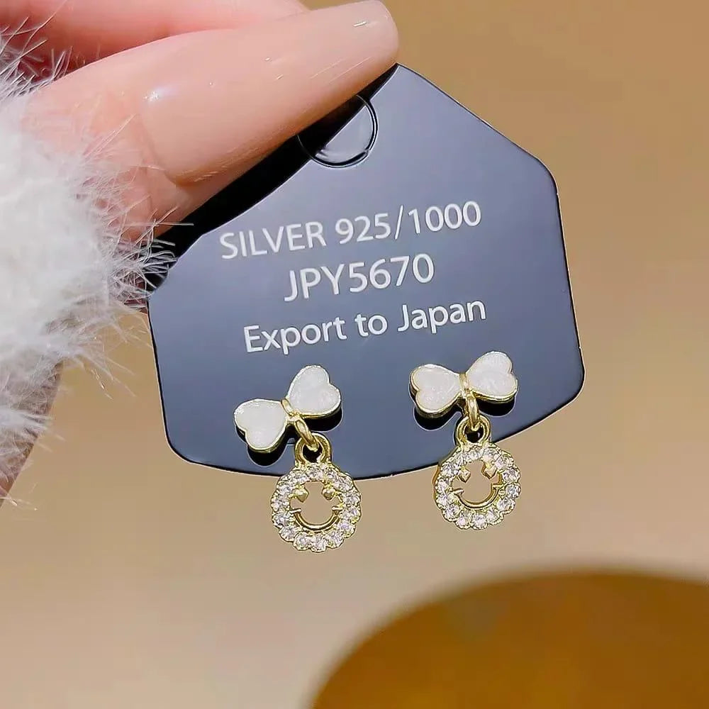 Elegant Bow Hollow Circle Drop Earrings – Each - Buy Online in Pakistan at Cosmia.pk
