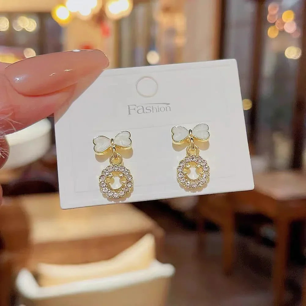Elegant Bow Hollow Circle Drop Earrings – Each - Buy Online in Pakistan at Cosmia.pk