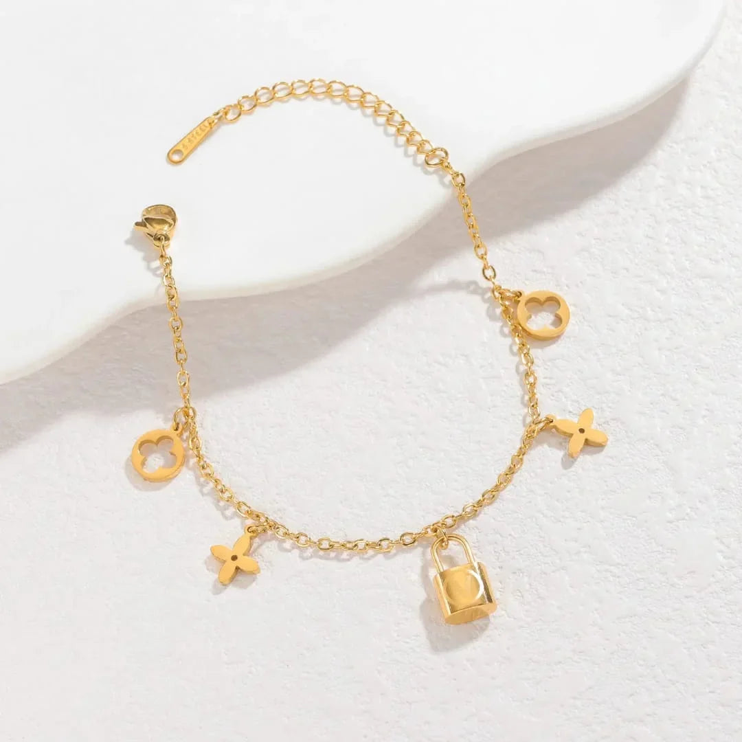Stainless Steel Lock Charm Bracelet with Clover & Flower Design - Buy Online in Pakistan at Cosmia.pk