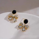 Rhinestone Bow Black Round Stud - Buy Online in Pakistan at Cosmia.pk