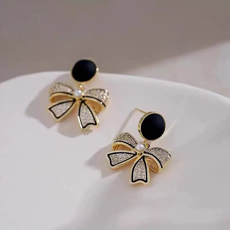 Rhinestone Bow Black Round Stud - Buy Online in Pakistan at Cosmia.pk
