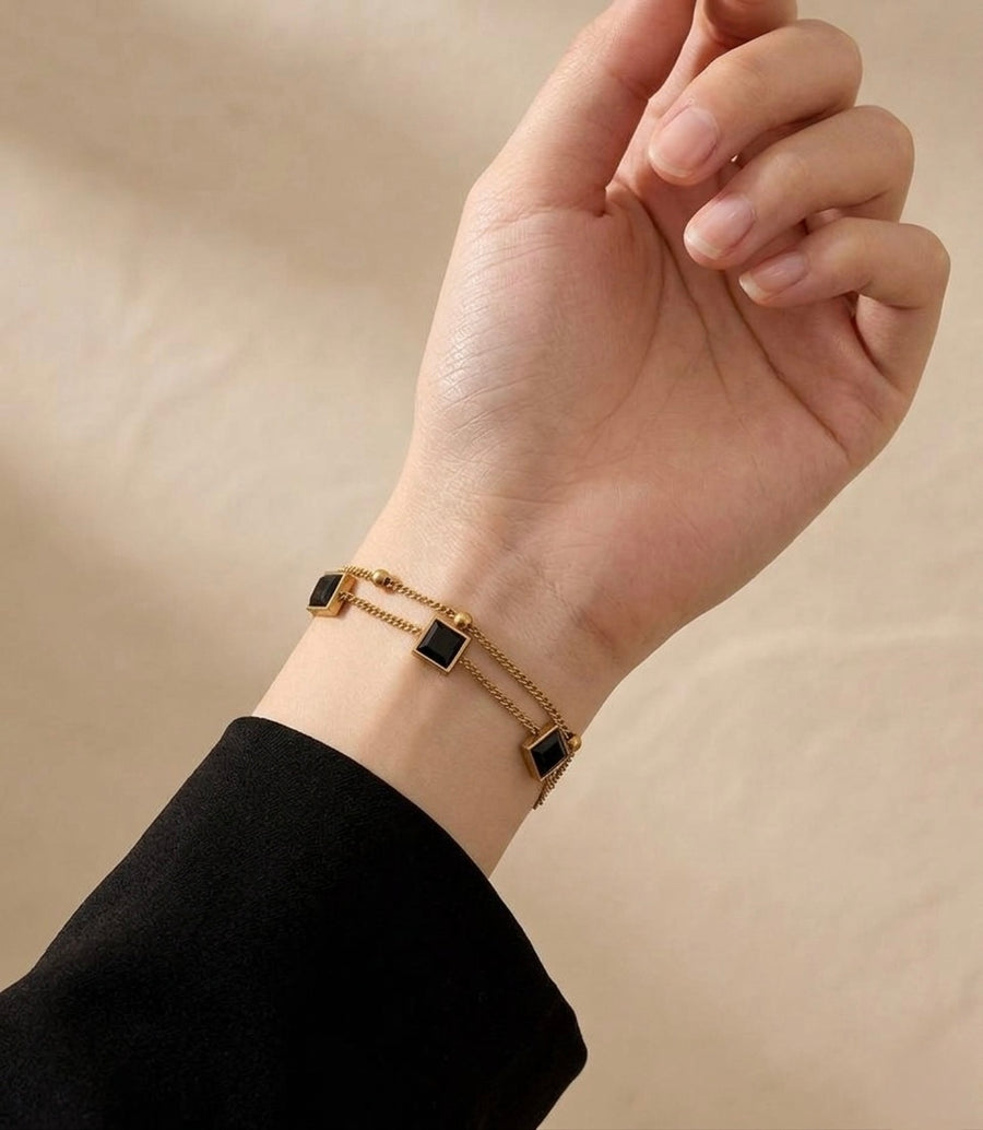 Black crystal cube charm bracelet on wrist