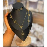 Gold bowknot jewelry set - bow necklace with matching bracelet and stud earrings