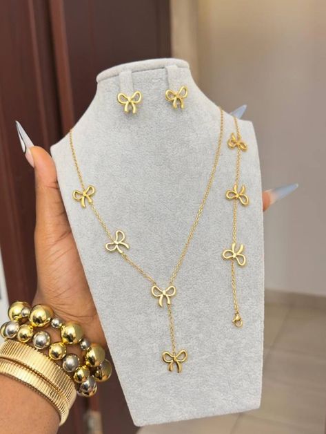Bowknot bracelet and earrings closeup - light luxury gold jewelry gift set Pakistan