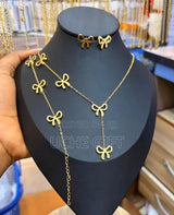 Gold bow necklace set worn on display - 316L stainless steel bowknot jewelry set for women