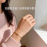 316L Stainless Steel Gold Love Knot Bracelet for Women - lifestyle wrist shot