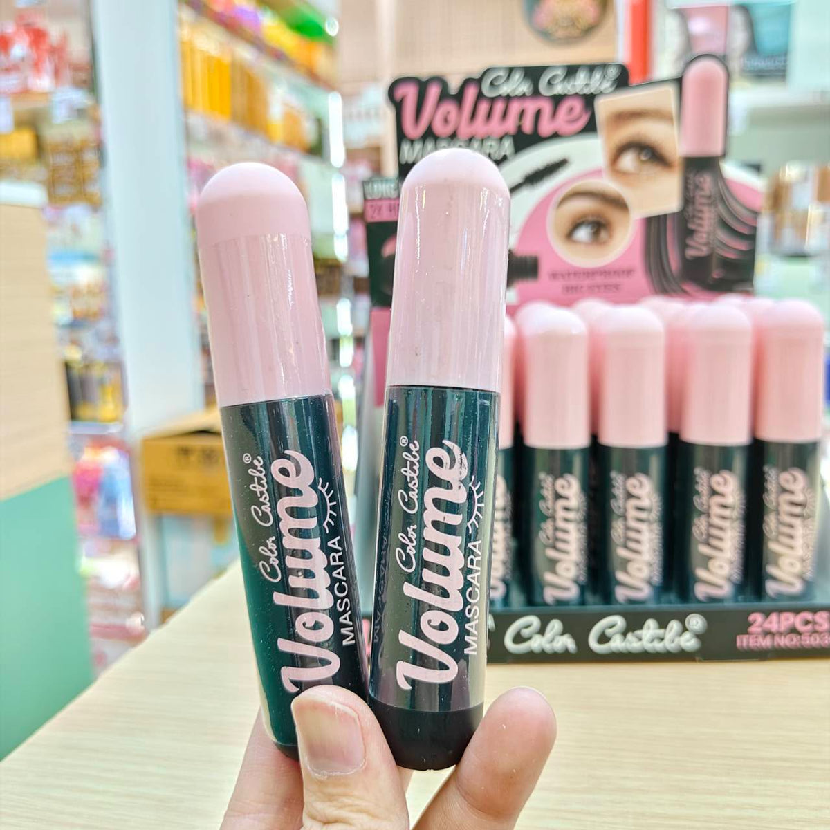 Color Castile Volume Mascara two tubes held in hand closeup