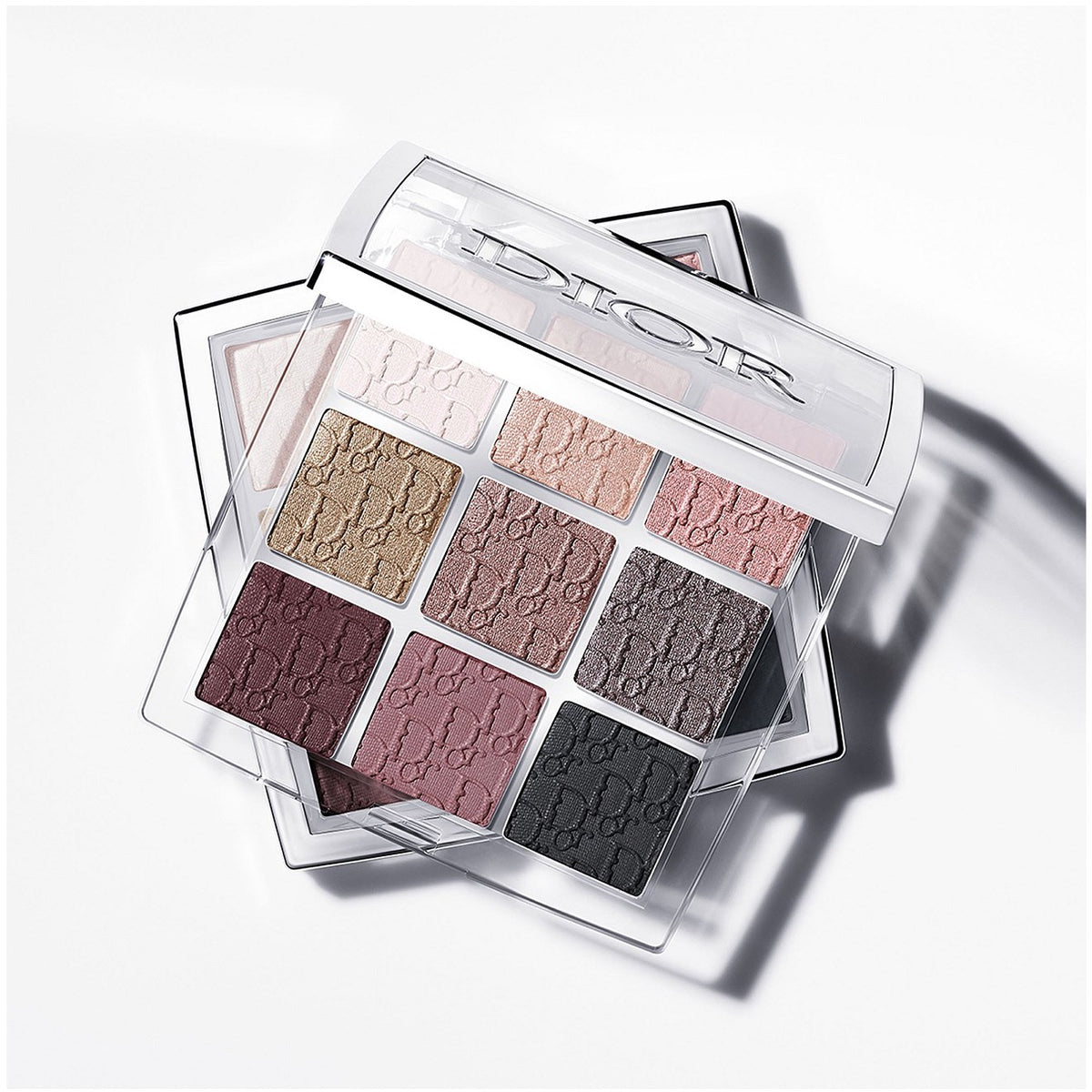 Dior Backstage Eye Palette - professional studio angled shot, smoky shade family with greys, plum, mauve and black