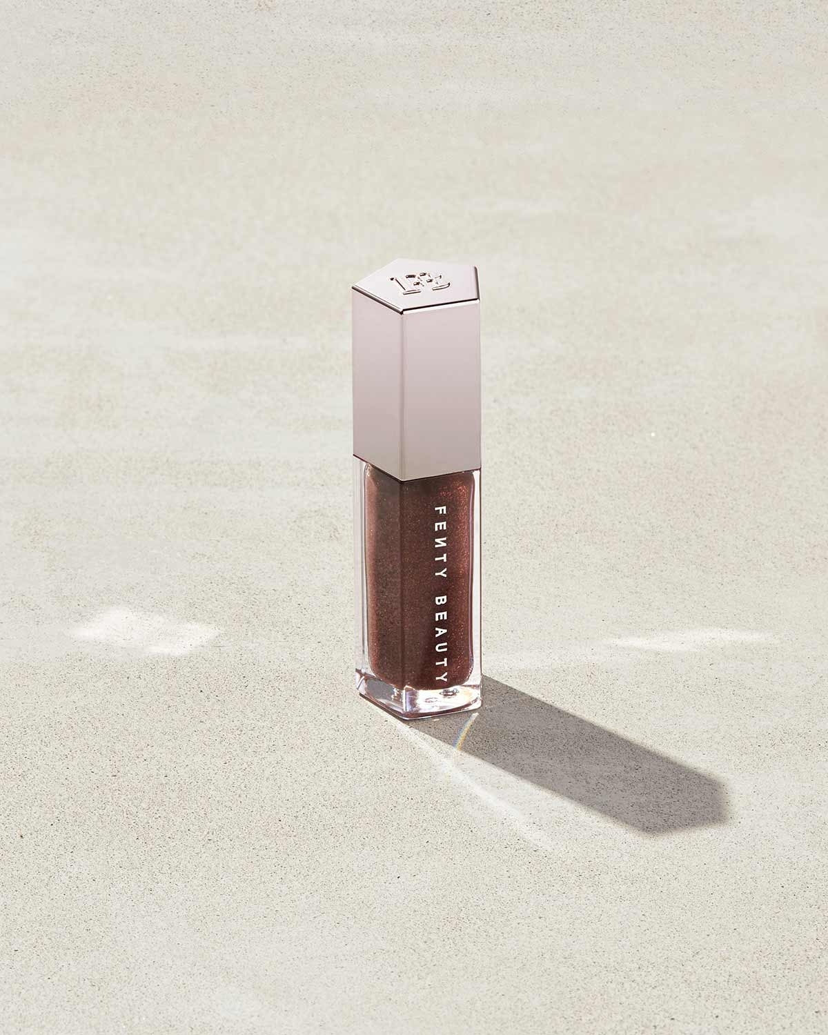 Fenty Beauty Gloss Bomb Universal Lip Luminizer shade Hot Chocolit 05 (rich chocolate brown shimmer) 9ml - buy online in Pakistan at Cosmia.pk