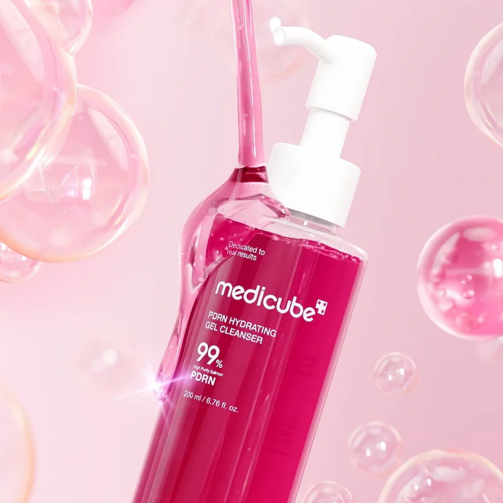 Medicube PDRN Hydrating Gel Cleanser pouring pink gel with bubbles