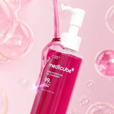 Medicube PDRN Hydrating Gel Cleanser pouring pink gel with bubbles