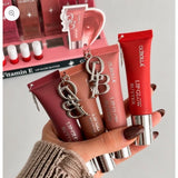 Olibolla Vitamin E Lip Glow Butter tubes held in hand with display