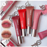 Olibolla Vitamin E Lip Glow Butter tubes with lip swatch insets