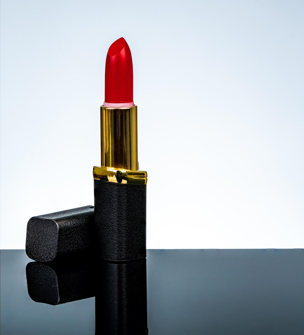 Art Skin Matte Lipstick red shade open tube