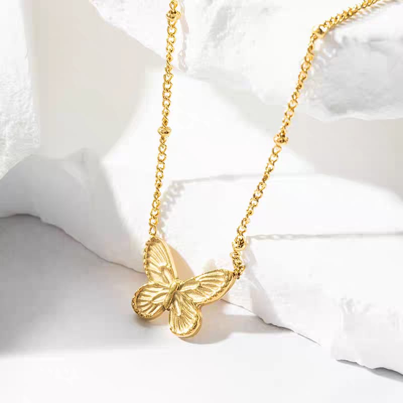 Stainless steel golden butterfly pendant necklace for women - buy online in Pakistan at Cosmia.pk (photo 3 of 5)