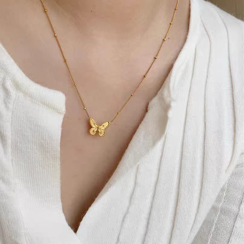 Stainless steel golden butterfly pendant necklace for women - buy online in Pakistan at Cosmia.pk (photo 4 of 5)