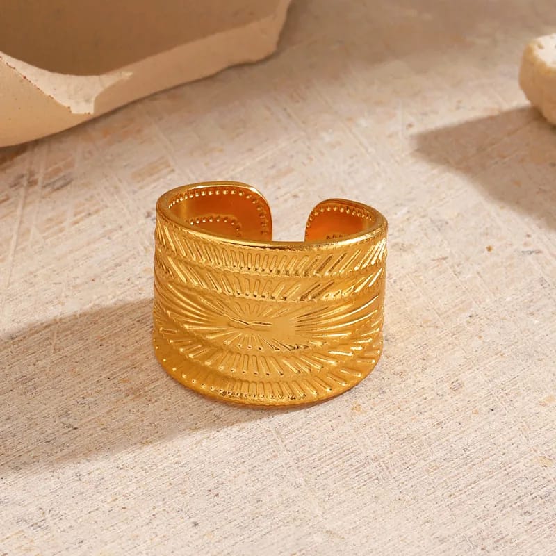 Stainless Steel Textured Wide Thick Golden Open Ring lifestyle shot on textured surface - buy online in Pakistan at Cosmia.pk