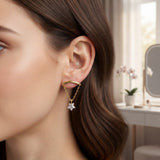 Gold curved bar labret stud earrings with dangling chain and star zircon crystal